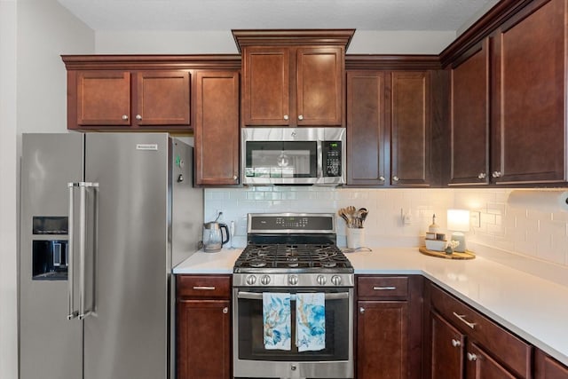 12327 Halfmoon Lake Ter, Bradenton, FL 34211 - kitchen with stainless steel appliances, light countertops, and tasteful backsplash