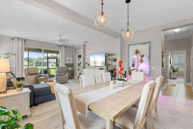12327 Halfmoon Lake Ter, Bradenton, FL 34211 - dining room featuring a ceiling fan and light tile patterned floors