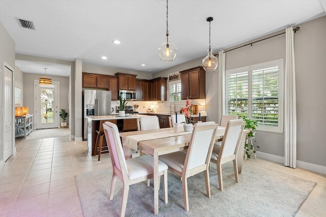 12327 Halfmoon Lake Ter, Bradenton, FL 34211 - dining area featuring light tile patterned floors and recessed lighting