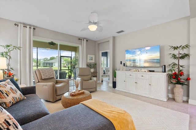 12327 Halfmoon Lake Ter, Bradenton, FL 34211 - living area featuring a ceiling fan and light tile patterned floors