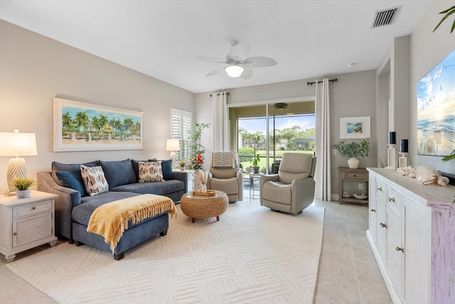 12327 Halfmoon Lake Ter, Bradenton, FL 34211 - living room featuring a ceiling fan and light tile patterned floors