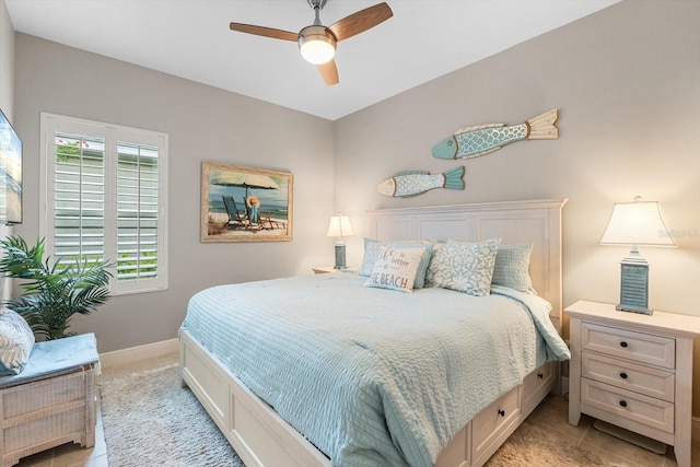 12327 Halfmoon Lake Ter, Bradenton, FL 34211 - bedroom with light carpet, ceiling fan, and light tile patterned floors