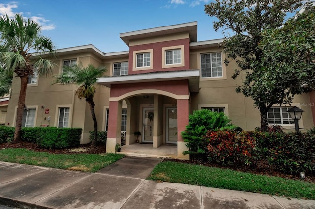 3707 45th Ter W Unit 104, Bradenton, FL 34210 - townhome / multi-family property with stucco siding and a porch