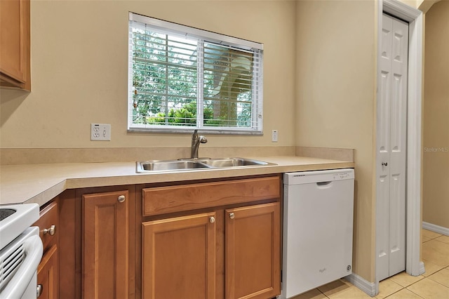 3707 45th Ter W Unit 104, Bradenton, FL 34210 - kitchen featuring white appliances, a sink, light tile patterned floors, and light countertops