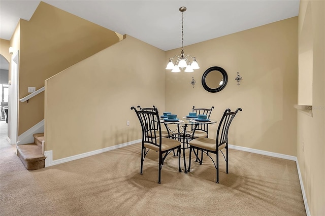 3707 45th Ter W Unit 104, Bradenton, FL 34210 - carpeted dining area featuring a chandelier, stairway, and baseboards