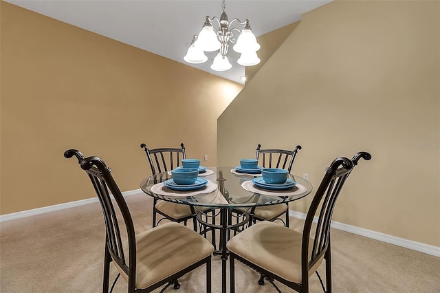 3707 45th Ter W Unit 104, Bradenton, FL 34210 - dining area with light colored carpet, a chandelier, and baseboards