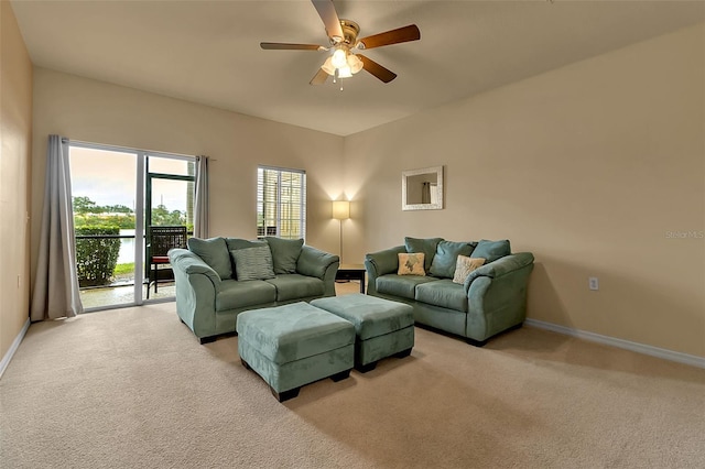 3707 45th Ter W Unit 104, Bradenton, FL 34210 - living area featuring light carpet, ceiling fan, and baseboards