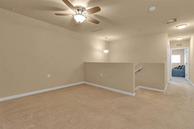 3707 45th Ter W Unit 104, Bradenton, FL 34210 - unfurnished room featuring light colored carpet, ceiling fan, a smoke detector, and baseboards