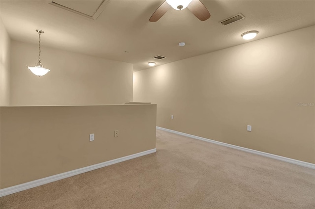 3707 45th Ter W Unit 104, Bradenton, FL 34210 - spare room featuring light carpet, baseboards, and ceiling fan