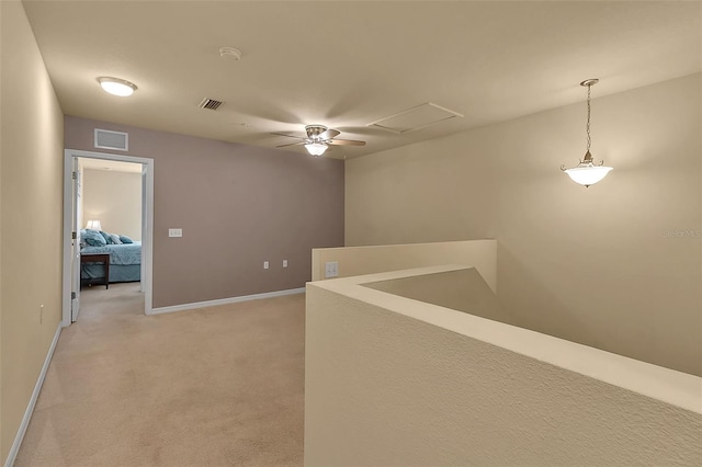3707 45th Ter W Unit 104, Bradenton, FL 34210 - corridor with an upstairs landing, light carpet, baseboards, and attic access