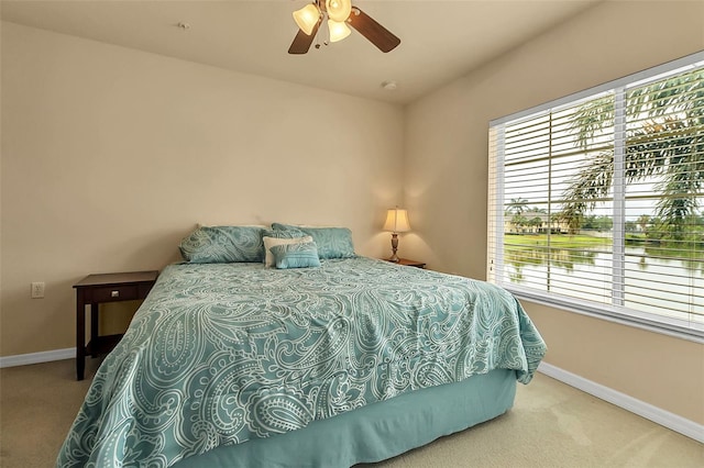 3707 45th Ter W Unit 104, Bradenton, FL 34210 - carpeted bedroom with multiple windows, baseboards, and a ceiling fan