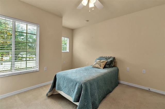3707 45th Ter W Unit 104, Bradenton, FL 34210 - carpeted bedroom featuring baseboards and a ceiling fan