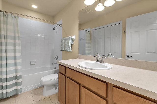 3707 45th Ter W Unit 104, Bradenton, FL 34210 - bathroom featuring tile patterned floors, vanity, shower / bath combo with shower curtain, and toilet