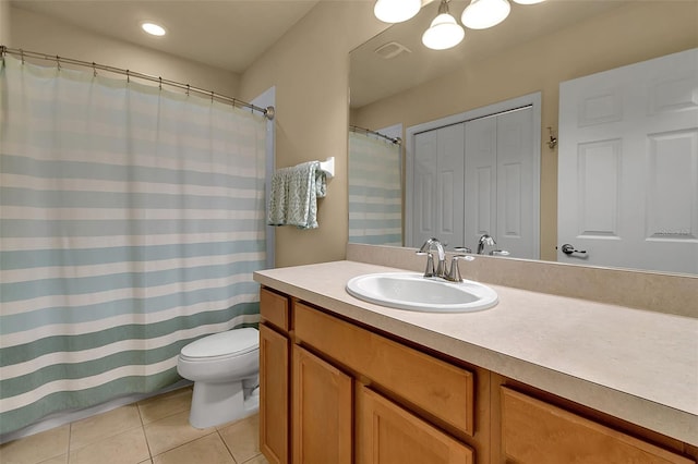 3707 45th Ter W Unit 104, Bradenton, FL 34210 - bathroom featuring tile patterned flooring, toilet, vanity, and a shower with shower curtain