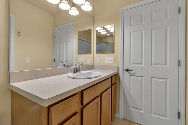 3707 45th Ter W Unit 104, Bradenton, FL 34210 - bathroom featuring vanity, a chandelier, and tile patterned floors