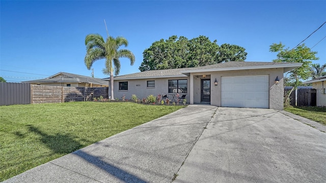 4611 Spahn St, Sarasota, FL 34232 - ranch-style house featuring a garage, stucco siding, and driveway