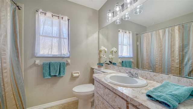 4611 Spahn St, Sarasota, FL 34232 - full bathroom featuring vanity, toilet, baseboards, tile patterned flooring, and curtained shower