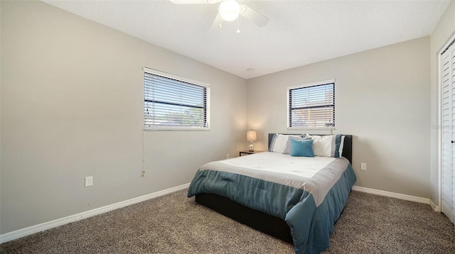4611 Spahn St, Sarasota, FL 34232 - carpeted bedroom with baseboards, ceiling fan, and a textured ceiling