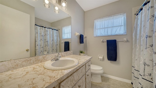 4611 Spahn St, Sarasota, FL 34232 - bathroom featuring vanity, toilet, tile patterned floors, baseboards, and curtained shower