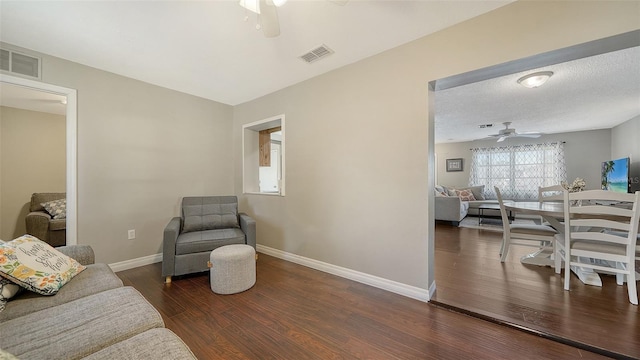 4611 Spahn St, Sarasota, FL 34232 - living area featuring a ceiling fan, wood finished floors, and baseboards
