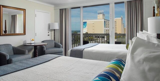 5500 Gulf Blvd Unit 6248, Saint Petersburg, FL 33706 - bedroom with access to exterior, ornamental molding, a city view, and a closet