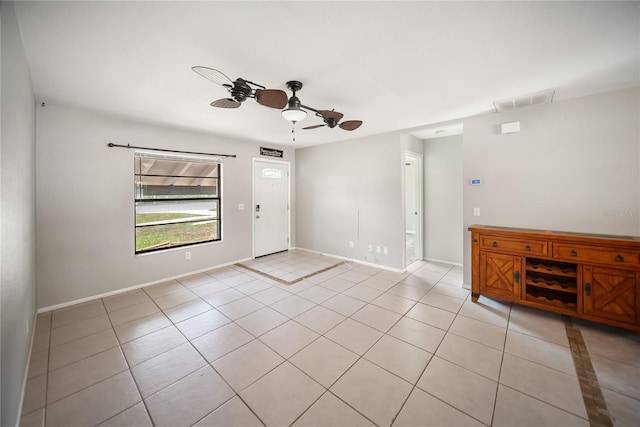 16834 Toledo Blade Blvd, Port Charlotte, FL 33954 - spare room featuring a ceiling fan, light tile patterned floors, and baseboards