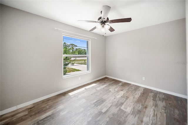 16834 Toledo Blade Blvd, Port Charlotte, FL 33954 - unfurnished room with wood finished floors, a ceiling fan, and baseboards