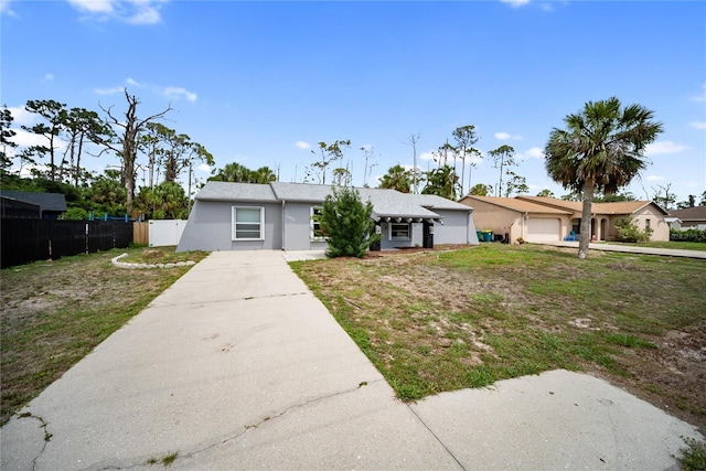 16834 Toledo Blade Blvd, Port Charlotte, FL 33954 - view of front of property with concrete driveway and stucco siding