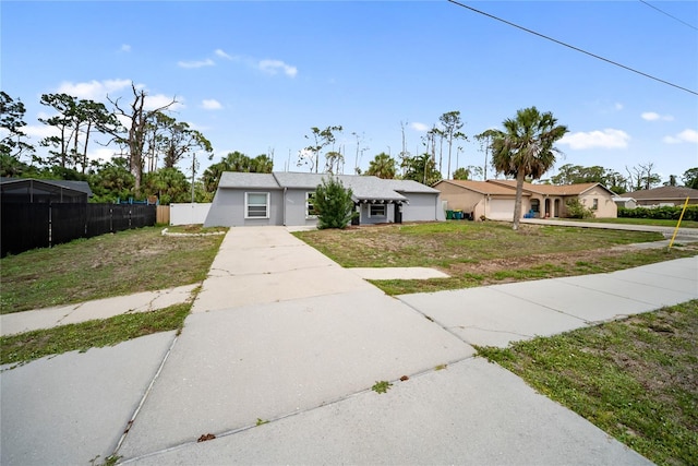 16834 Toledo Blade Blvd, Port Charlotte, FL 33954 - view of front of house with driveway and stucco siding