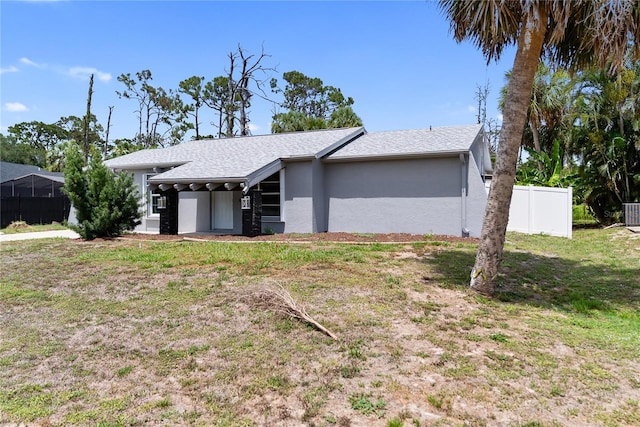 16834 Toledo Blade Blvd, Port Charlotte, FL 33954 - view of home's exterior featuring stucco siding and a shingled roof