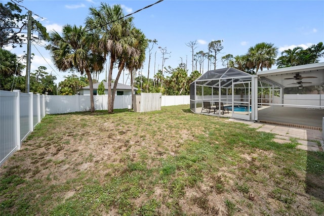 16834 Toledo Blade Blvd, Port Charlotte, FL 33954 - view of yard featuring ceiling fan, a patio area, and a lanai