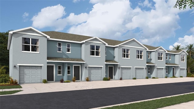 4314 Miller Point Ct, Bradenton, FL 34208 - townhome / multi-family property with a garage, driveway, stucco siding, and a residential view