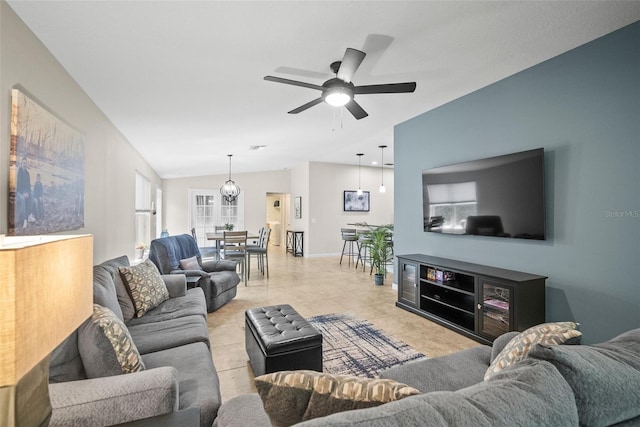 5866 Guarino Dr, Sarasota, FL 34238 - living area featuring vaulted ceiling, a ceiling fan, and baseboards