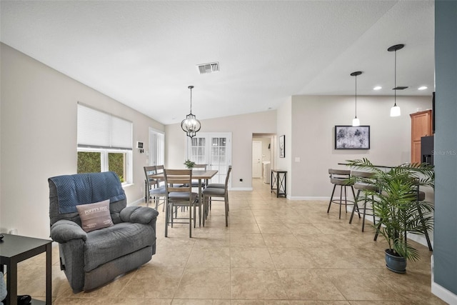 5866 Guarino Dr, Sarasota, FL 34238 - dining area with baseboards, recessed lighting, light tile patterned flooring, vaulted ceiling, and a chandelier