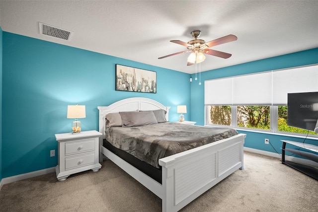 5866 Guarino Dr, Sarasota, FL 34238 - carpeted bedroom with baseboards and ceiling fan
