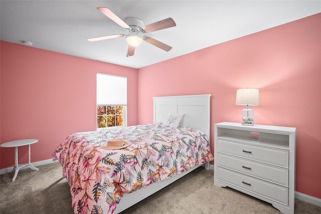 5866 Guarino Dr, Sarasota, FL 34238 - bedroom featuring carpet flooring, baseboards, and ceiling fan
