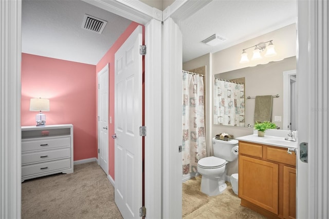 5866 Guarino Dr, Sarasota, FL 34238 - bathroom with toilet, vanity, and a shower with shower curtain