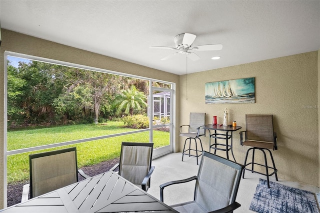 5866 Guarino Dr, Sarasota, FL 34238 - sunroom featuring a ceiling fan, healthy amount of natural light, and outdoor dining space