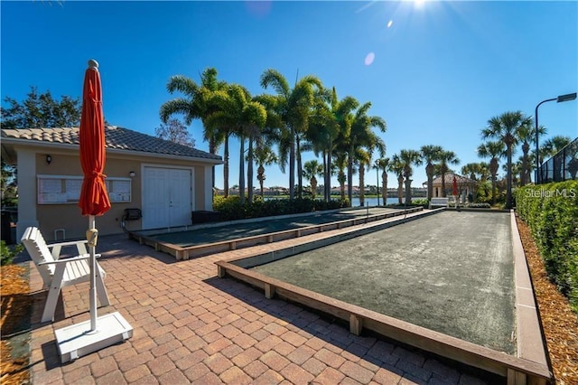 5866 Guarino Dr, Sarasota, FL 34238 - view of home's community with a bocce ball area
