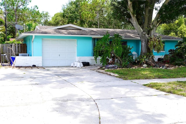 1099 6th Ave NE, Largo, FL 33770 - ranch-style home featuring driveway and a garage