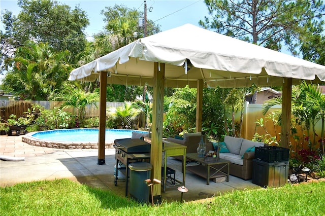 1099 6th Ave NE, Largo, FL 33770 - fenced backyard with a gazebo, an outdoor hangout area, and a patio