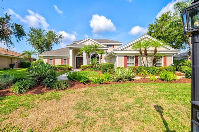 8930 Bloomfield Blvd, Sarasota, FL 34238 - view of front of property featuring a front yard and stucco siding