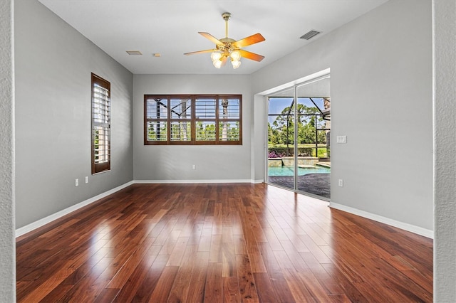 8930 Bloomfield Blvd, Sarasota, FL 34238 - empty room featuring a ceiling fan and dark wood-type flooring