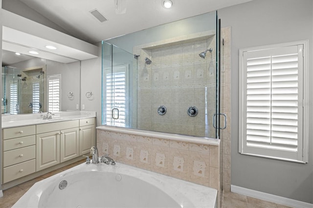 8930 Bloomfield Blvd, Sarasota, FL 34238 - full bath featuring a shower stall, a garden tub, vanity, and tile patterned flooring