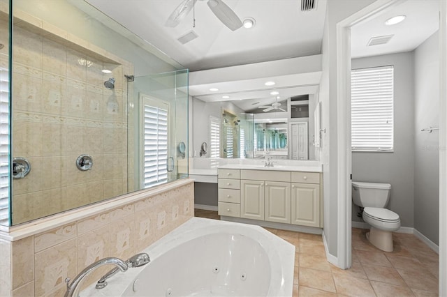 8930 Bloomfield Blvd, Sarasota, FL 34238 - bathroom featuring ceiling fan, a jetted tub, a stall shower, vanity, and tile patterned floors