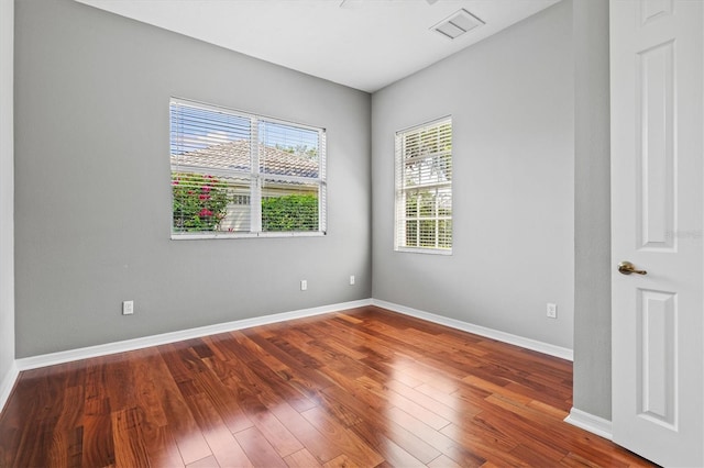 8930 Bloomfield Blvd, Sarasota, FL 34238 - unfurnished room with plenty of natural light and wood finished floors