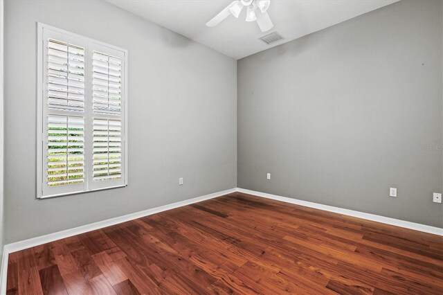 8930 Bloomfield Blvd, Sarasota, FL 34238 - empty room with ceiling fan and dark wood-style floors