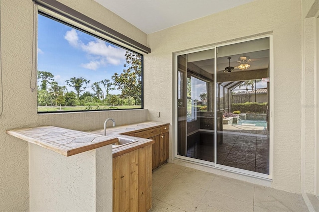 8930 Bloomfield Blvd, Sarasota, FL 34238 - bar with a textured wall and healthy amount of natural light
