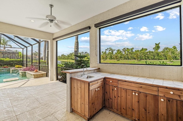 8930 Bloomfield Blvd, Sarasota, FL 34238 - unfurnished sunroom featuring ceiling fan