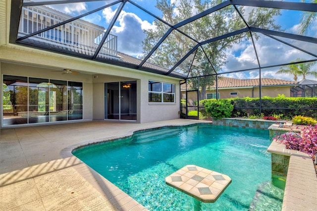 8930 Bloomfield Blvd, Sarasota, FL 34238 - outdoor pool with a patio area, ceiling fan, and glass enclosure
